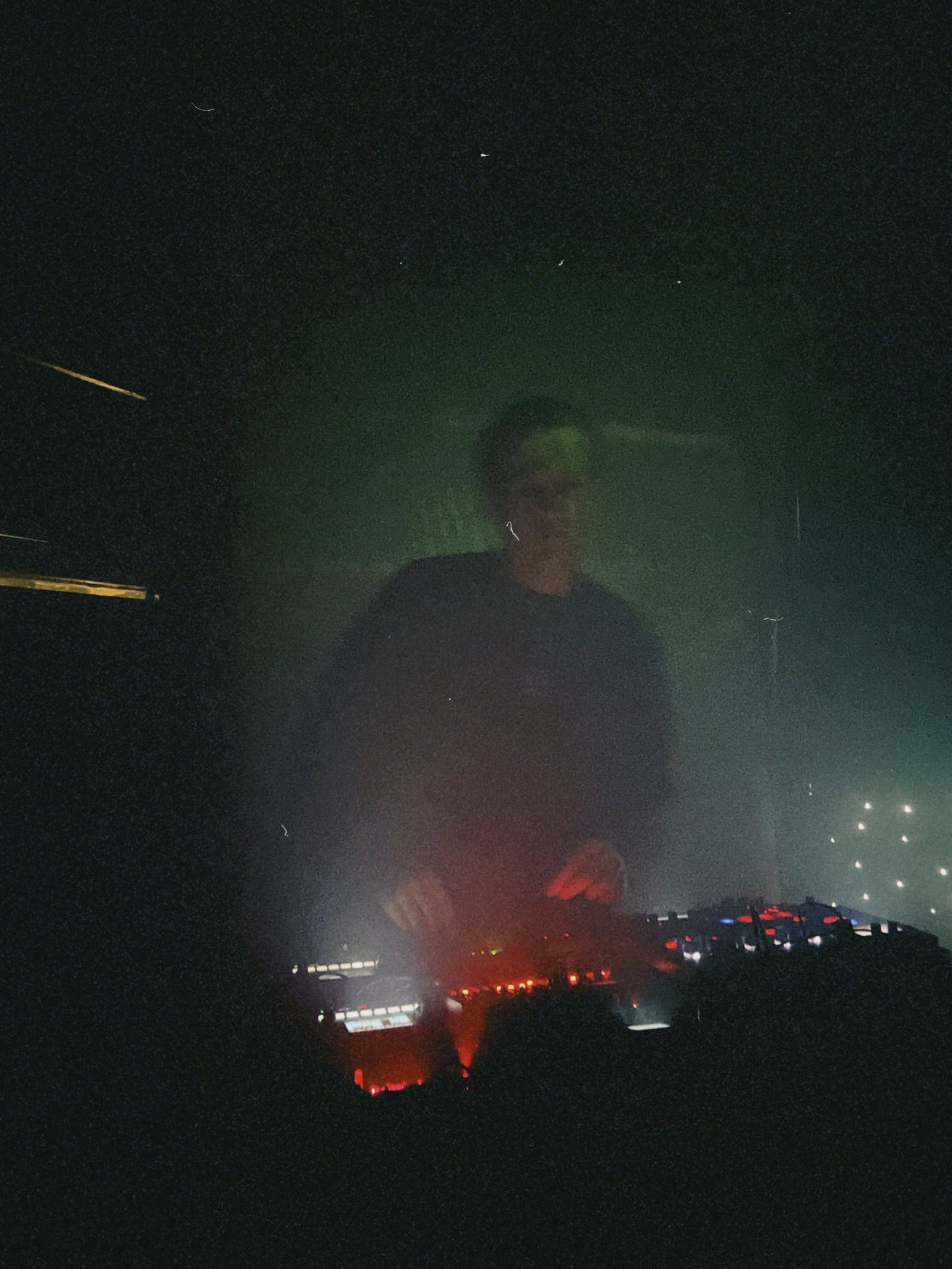 Pocket Rave in smoke and red light behind the gear