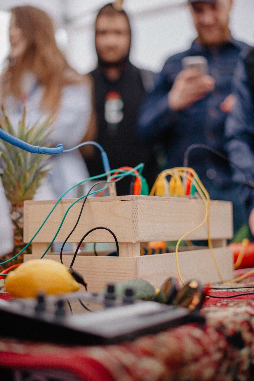 Fruits wired to a MIDI module in a wooden crate