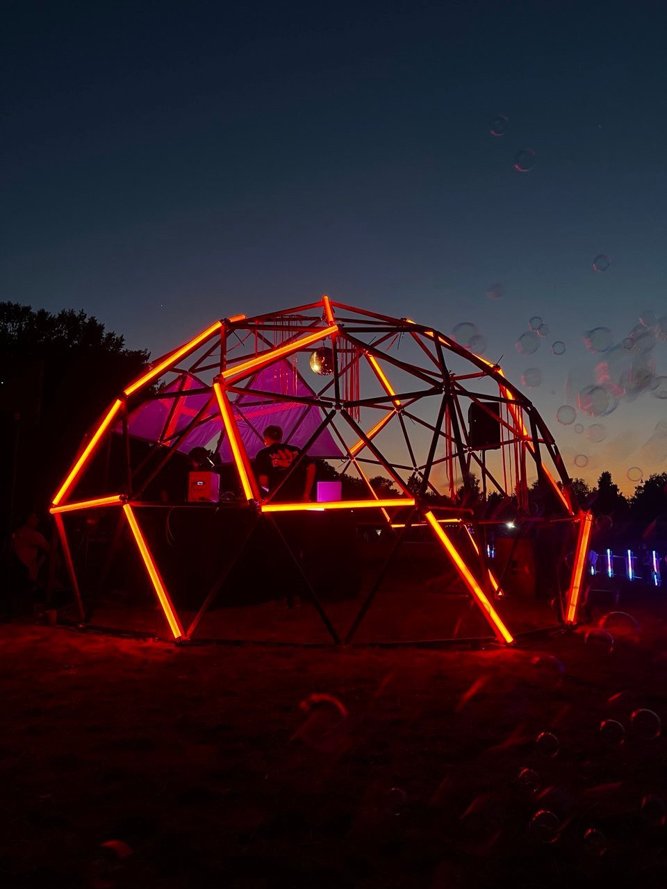 Illuminated geodome at night at the LTCŃ festival